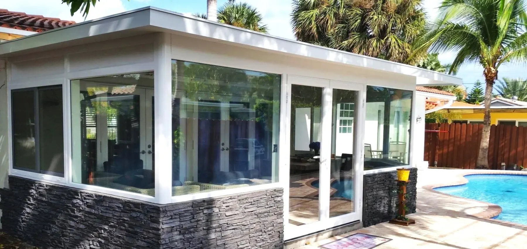 White Naturescape enclosure extending a Florida residence