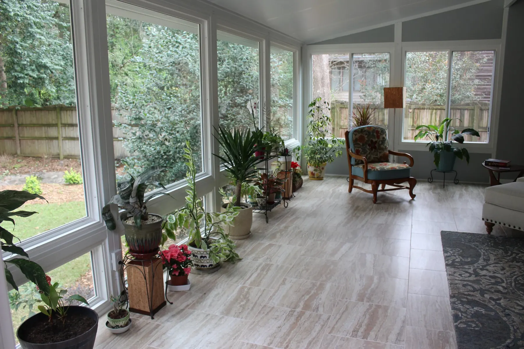 Light-filled Naturescape sunroom connected to the garden